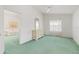 Serene bedroom featuring light dresser, soft green carpet, and a bright window view at 4528 Fern Dr, Bradenton, FL 34208