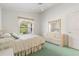 Bedroom with large window, ceiling fan, and neutral decor at 4528 Fern Dr, Bradenton, FL 34208