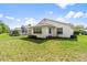 Charming single-story home with a well-maintained lawn and lush landscaping at 4528 Fern Dr, Bradenton, FL 34208