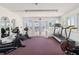 Fitness room featuring cardio machines and bright natural light at 4528 Fern Dr, Bradenton, FL 34208
