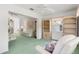 Open-concept living room with shelving and plenty of space for relaxing or entertaining at 4528 Fern Dr, Bradenton, FL 34208