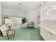 Bright and airy living room features high ceilings, lots of natural light and a pass-through bar to the kitchen at 4528 Fern Dr, Bradenton, FL 34208