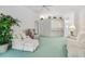 Bright living room features neutral-toned furniture, vaulted ceilings, and an open layout at 4528 Fern Dr, Bradenton, FL 34208