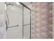 Shower with glass door and chrome fixtures at 4528 Fern Dr, Bradenton, FL 34208