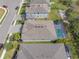 Aerial view of backyard with pool and landscaping at 5821 Hevena Ct, Palmetto, FL 34221