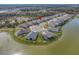 Beautiful aerial view of a neighborhood featuring homes around a pond in a vibrant community at 5821 Hevena Ct, Palmetto, FL 34221