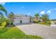 A well-maintained house with a paver driveway and a 2-car garage at 5821 Hevena Ct, Palmetto, FL 34221