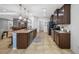 Spacious kitchen with stainless steel appliances, dark cabinets and a kitchen island with seating at 5821 Hevena Ct, Palmetto, FL 34221