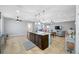 Open-concept kitchen with island, stainless steel appliances and plenty of room to move around at 5821 Hevena Ct, Palmetto, FL 34221