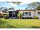 Back of house showing screened in patio with view of backyard at 6205 Green View Dr # 129, Sarasota, FL 34231