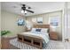 Charming bedroom featuring natural light, ceiling fan and wood furniture at 6205 Green View Dr # 129, Sarasota, FL 34231