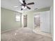 Bedroom leading to walk-in closet and en-suite bathroom at 6205 Green View Dr # 129, Sarasota, FL 34231
