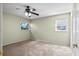 Bedroom featuring neutral walls, carpeted flooring, ceiling fan and natural light at 6205 Green View Dr # 129, Sarasota, FL 34231