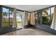 Enclosed back porch with vinyl flooring and view of fenced backyard at 6205 Green View Dr # 129, Sarasota, FL 34231
