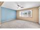 Bright living room with neutral walls, carpet flooring, ceiling fan and window at 6205 Green View Dr # 129, Sarasota, FL 34231