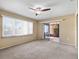 Carpeted living room with sliding door to enclosed back porch at 6205 Green View Dr # 129, Sarasota, FL 34231