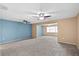 Large carpeted living space with ceiling fans and multiple windows allowing natural light at 6205 Green View Dr # 129, Sarasota, FL 34231