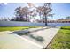 Outdoor shuffleboard courts with surrounding green space and trees at 6205 Green View Dr # 129, Sarasota, FL 34231