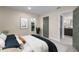 Cozy bedroom with neutral walls, wood-look floors, and a view of the backyard at 6705 20Th W Ave, Bradenton, FL 34209