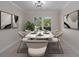 Elegant dining room with a marble table set, modern lighting, and views of the outdoors at 6705 20Th W Ave, Bradenton, FL 34209