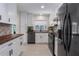 Modern kitchen featuring white cabinetry, wood countertops and stainless steel appliances at 6705 20Th W Ave, Bradenton, FL 34209