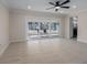 Bright living room with sliding glass doors to the patio and tile flooring throughout at 6705 20Th W Ave, Bradenton, FL 34209