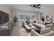 Bright living room featuring neutral tones, modern furnishings, and sliding glass doors to the outdoor space at 6705 20Th W Ave, Bradenton, FL 34209