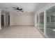 Bright living room with sliding glass doors to the patio and tile flooring throughout at 6705 20Th W Ave, Bradenton, FL 34209