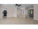 Open-concept living room with neutral paint, tile floors and plenty of natural light at 6705 20Th W Ave, Bradenton, FL 34209