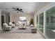 Spacious living room with stylish décor, light wood floors, and sliding glass doors to patio at 6705 20Th W Ave, Bradenton, FL 34209