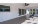 Enclosed patio with ceiling fan and space for outdoor seating at 6705 20Th W Ave, Bradenton, FL 34209