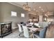 Contemporary dining room with a stylish bar, chandelier, and an open floor plan to the kitchen at 7760 Grande Shores Dr, Sarasota, FL 34240