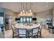 Entertain in the full kitchen featuring stainless appliances, dining area, and plenty of counter space at 7760 Grande Shores Dr, Sarasota, FL 34240