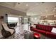 Bright living room with tile floors, coffered ceilings, and access to the outdoor patio at 7760 Grande Shores Dr, Sarasota, FL 34240