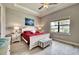 Bright main bedroom with a tray ceiling, a large window, and stylish furnishings at 7760 Grande Shores Dr, Sarasota, FL 34240