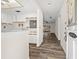 Inviting entryway featuring wood flooring and a view into the sunny living area at 1022 De Soto Dr, Dunedin, FL 34698