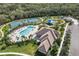 Aerial showcasing the community pool, tennis courts and playground for outdoor activities and relaxation at 12810 Daisy Pl, Bradenton, FL 34212