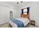 Comfortable bedroom featuring a wooden bed frame, a large closet and neutral decor at 12810 Daisy Pl, Bradenton, FL 34212