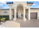 Elegant home showcasing a grand entrance with stately columns and a well-manicured landscape at 12810 Daisy Pl, Bradenton, FL 34212