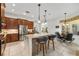 Open kitchen with granite countertops, a large island with bar seating and stainless steel appliances at 12810 Daisy Pl, Bradenton, FL 34212