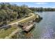 Scenic lake view with a wooden dock and walking path, perfect for enjoying nature and the outdoors at 12810 Daisy Pl, Bradenton, FL 34212