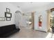 Living area leading to outdoor pool area, features tile floors and lots of natural light at 12810 Daisy Pl, Bradenton, FL 34212