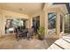 Outdoor dining area with a table and chairs, seamlessly connected to the indoor living space at 12810 Daisy Pl, Bradenton, FL 34212