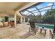 Inviting outdoor living area with a screened-in pool and plenty of seating for entertaining at 12810 Daisy Pl, Bradenton, FL 34212