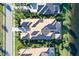 Stunning aerial view of a luxury home with a tile roof, lush landscaping, and a pristine lawn at 14733 Como Cir, Lakewood Ranch, FL 34202