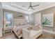 Inviting bedroom featuring a plush bed, stylish decor, and a serene ambiance for relaxation at 14733 Como Cir, Lakewood Ranch, FL 34202