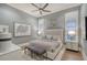 Serene bedroom with soft hues, a plush bed, stylish lighting, and elegant decor at 14733 Como Cir, Lakewood Ranch, FL 34202