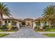 Stunning home featuring lush landscaping, a circular driveway, and a grand entrance at 14733 Como Cir, Lakewood Ranch, FL 34202