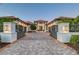 Beautiful home featuring a well manicured lawn, manicured shrubs, and a brick driveway at 14733 Como Cir, Lakewood Ranch, FL 34202