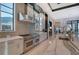 Modern kitchen featuring a professional-grade range, custom cabinets, and stylish countertops at 14733 Como Cir, Lakewood Ranch, FL 34202